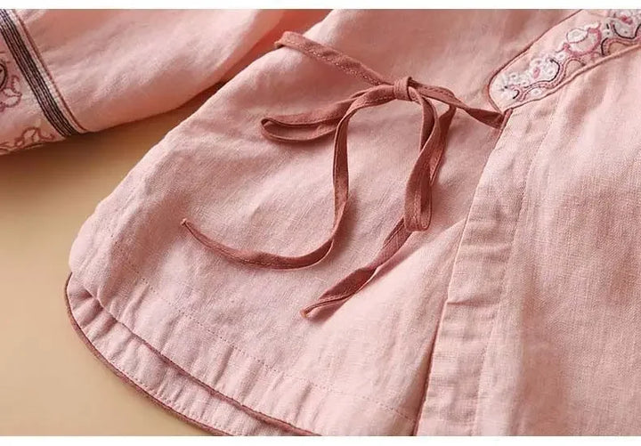 Breezy spring fashion v-neck blouse. Women's relaxed fit patterned top.