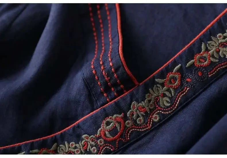 Embroidered-look patterned v-neck blouse. Women's relaxed fit elegant top.