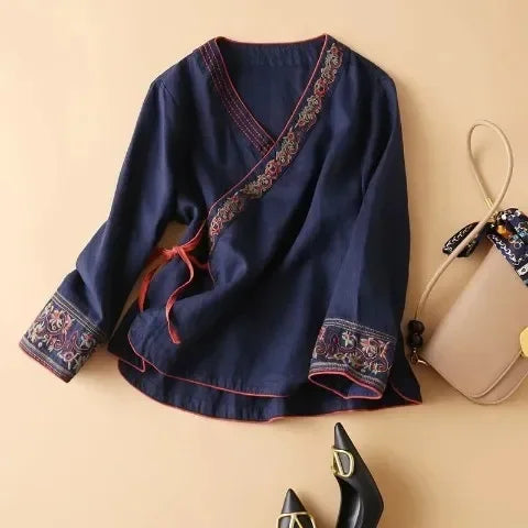Versatile women's patterned v-neck blouse. Relaxed fit for day-to-night elegance.