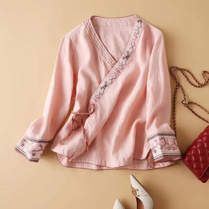 Spring fashion v-neck blouse for women. Relaxed fit & elegant pattern.