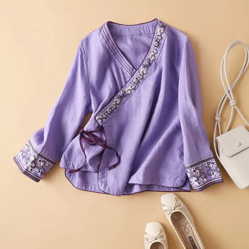 Relaxed fit patterned v-neck blouse. Comfortable women's top for casual wear.
