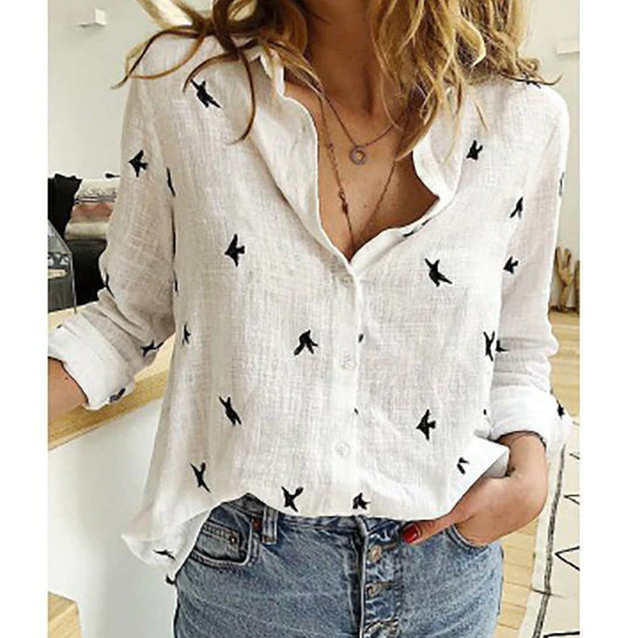 Fashionable women's relaxed fit blouse, elegant button-down with classic point collar detail.