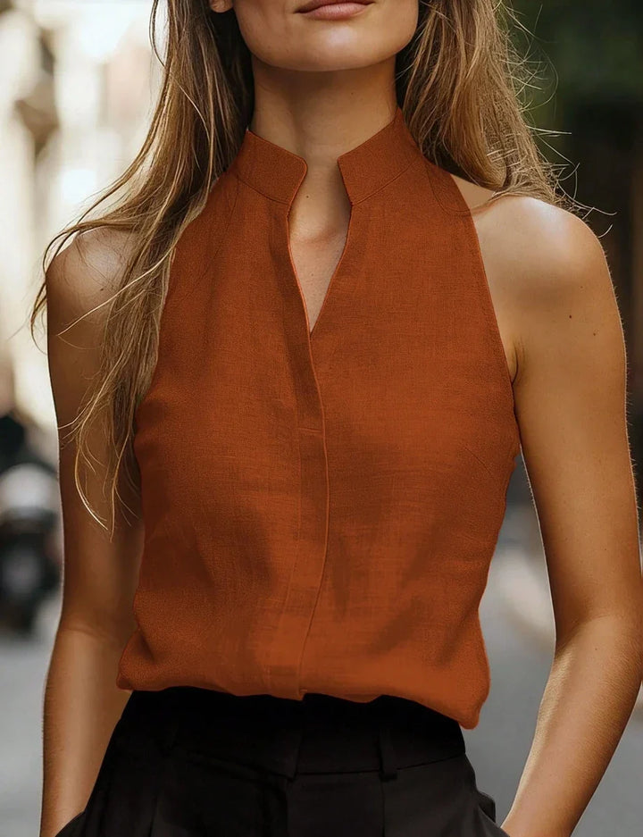 Women's relaxed fit sleeveless mock neck blouse, perfect for summer casual elegance.