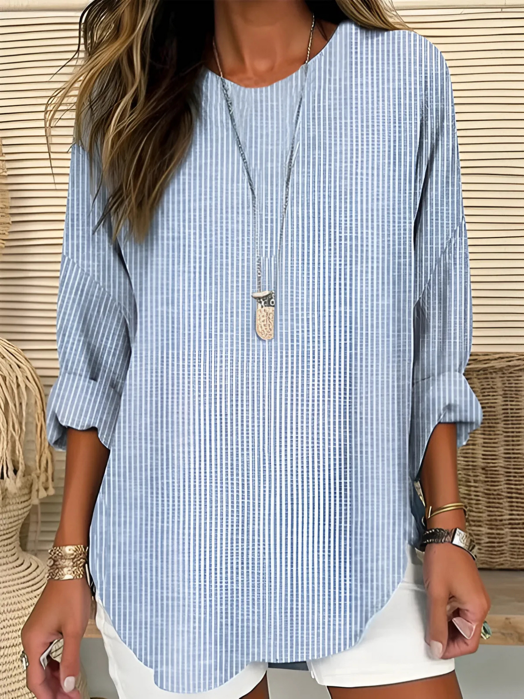Women's relaxed fit striped long sleeve blouse with a round neck, perfect for effortless casual wear & everyday style.