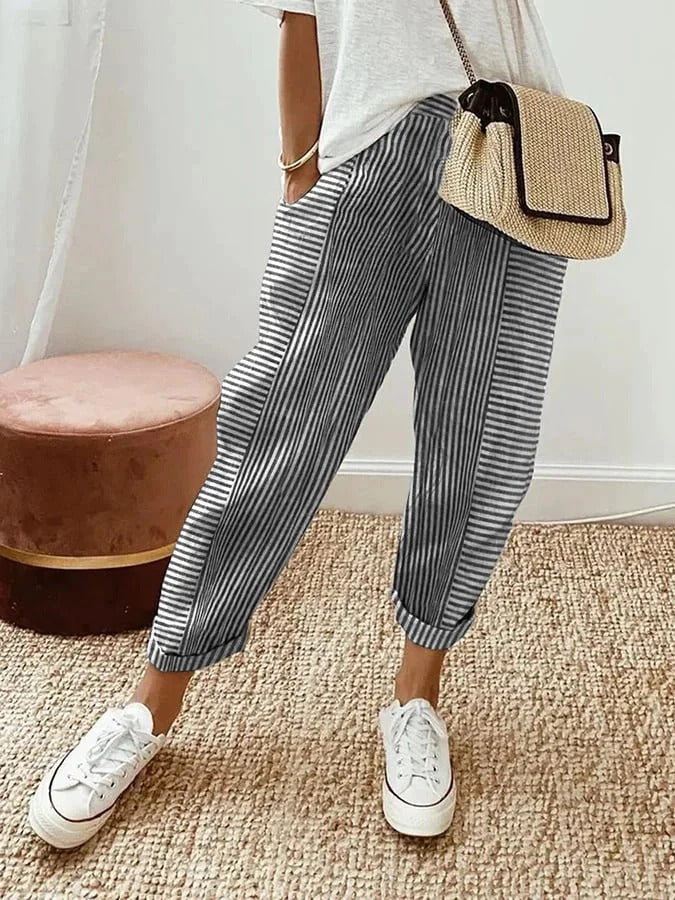 Soft fabric striped women's pants with a comfy drawstring closure, ideal for relaxation.