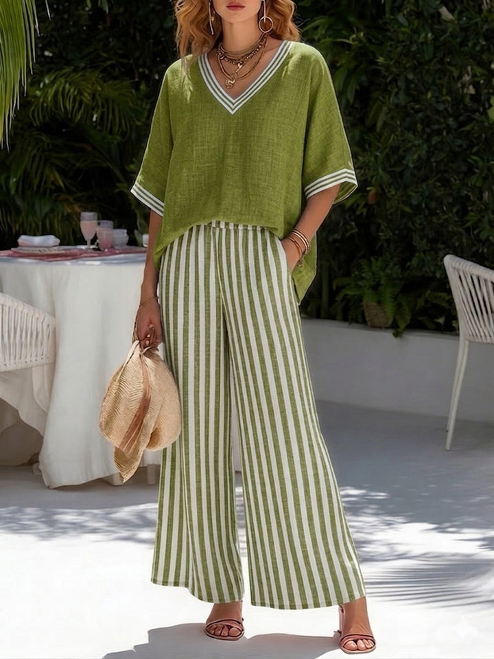 Women's casual striped two-piece set. Relaxed fit V-neck top and wide-leg pants, great for summer fashion.