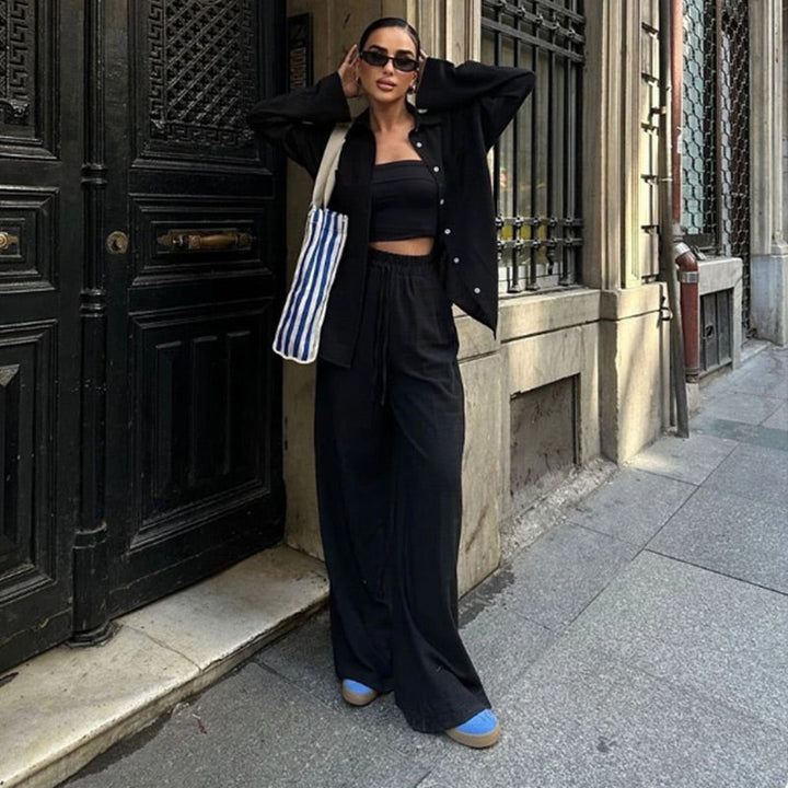 Chic women's relaxed fit two piece ensemble, including a button down top and comfortable wide leg pants.