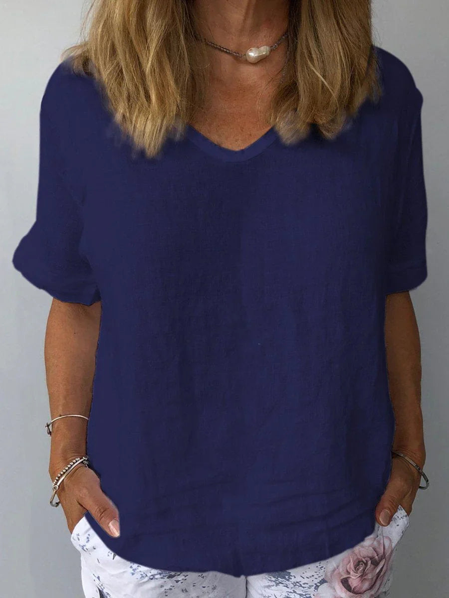 Women's relaxed fit V-neck blouse, short sleeve, ideal for casual everyday comfort.