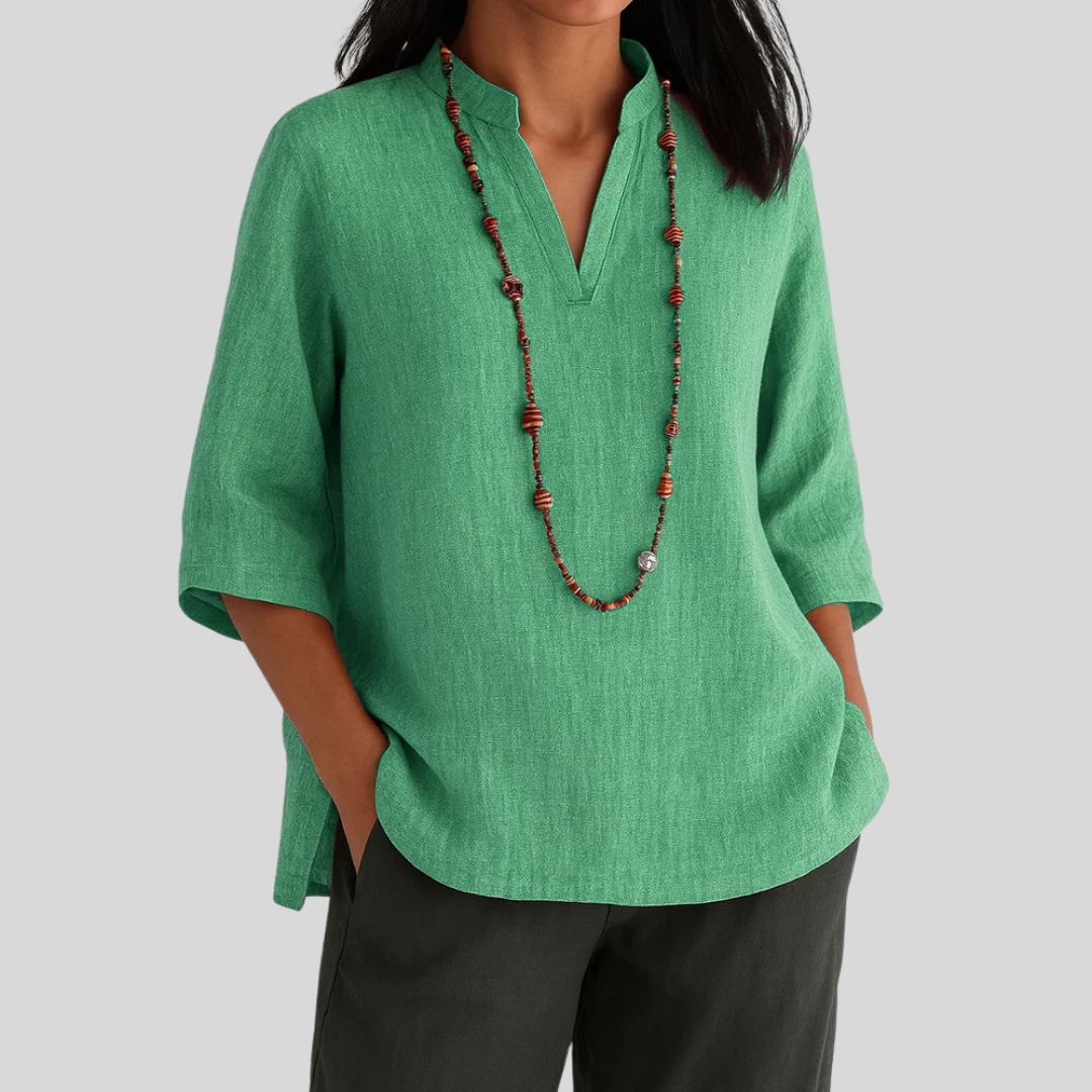 Women's relaxed fit V-neck blouse with 3/4 sleeves for casual daily wear. Comfortable & versatile fashion top.