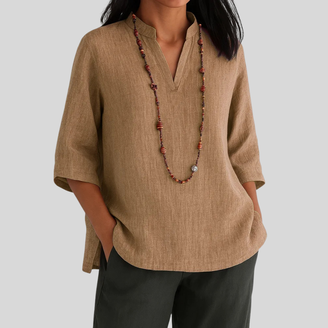 Comfortable women's V-neck blouse, relaxed fit with 3/4 sleeves. Stylish women's apparel for daily fashion.