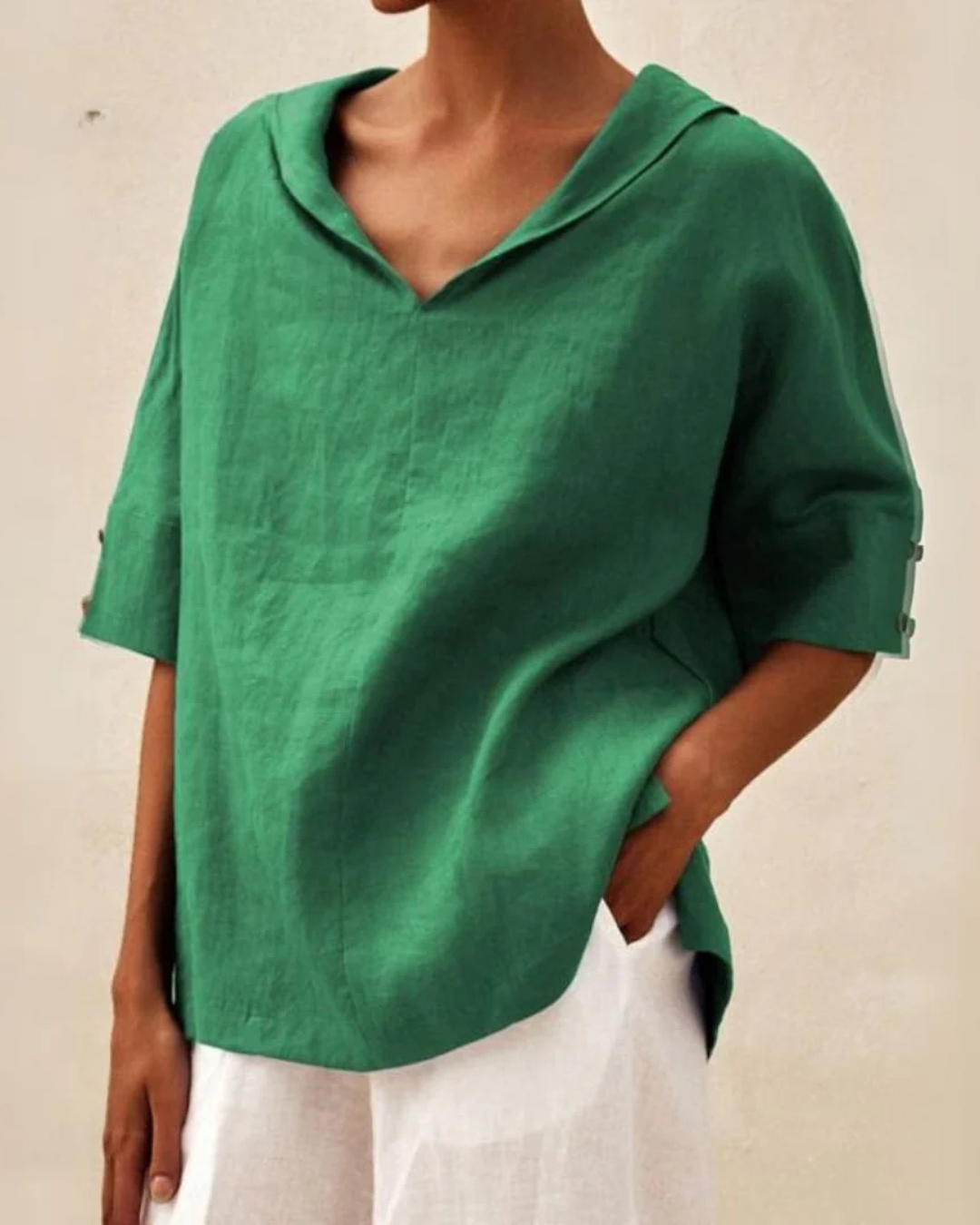 Women's relaxed fit V-neck blouse with short sleeves, perfect for casual everyday wear and summer fashion.