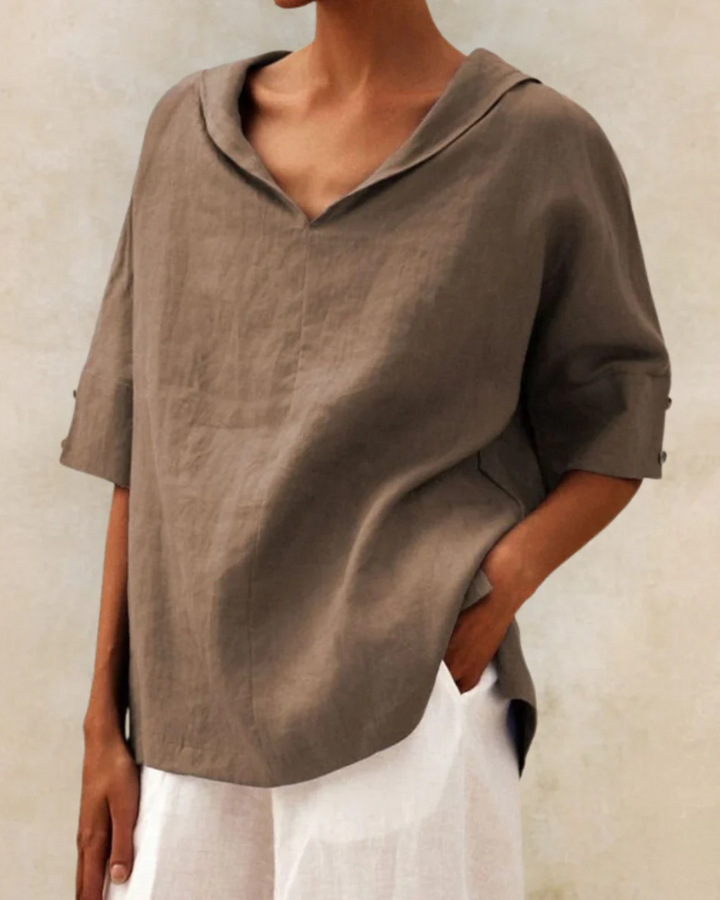 Stylish women's relaxed fit V-neck blouse. Short sleeve top for comfortable summer fashion and casual looks.