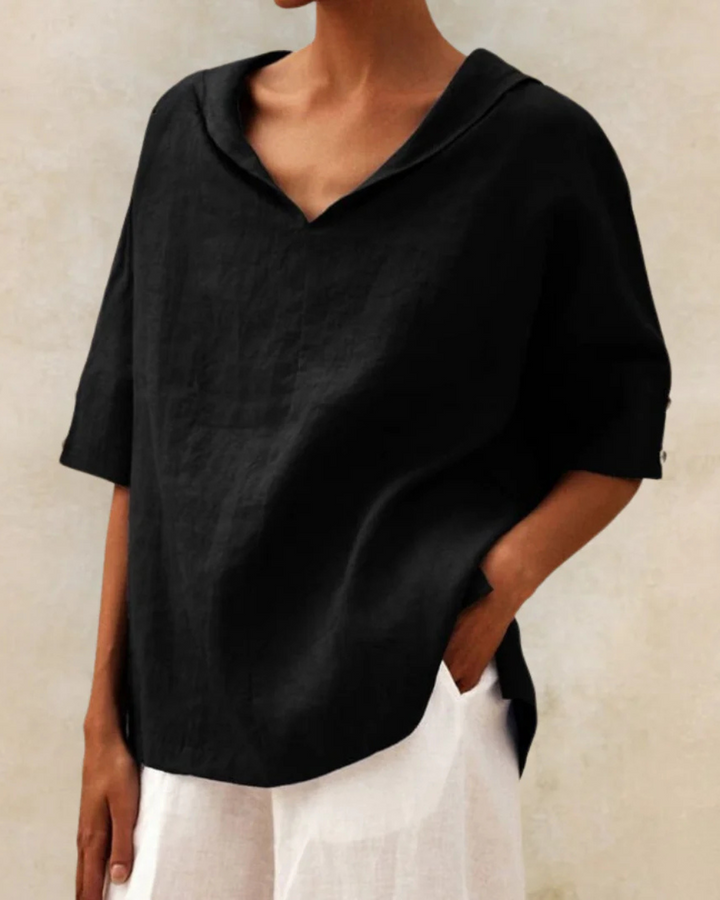 Chic women's V-neck blouse, relaxed fit & short sleeves. Ideal comfortable top for daily wear & summer.
