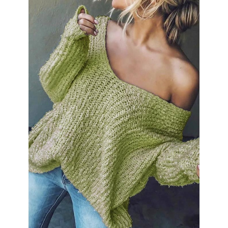 Close-up: Soft knit texture of a comfortable women's relaxed fit V-neck sweater for everyday style.