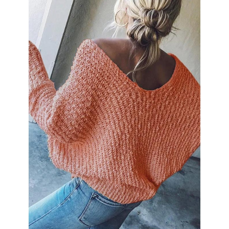 Relaxed fit women's knit V-neck sweater, a casual top with drop shoulders for versatile fashion.