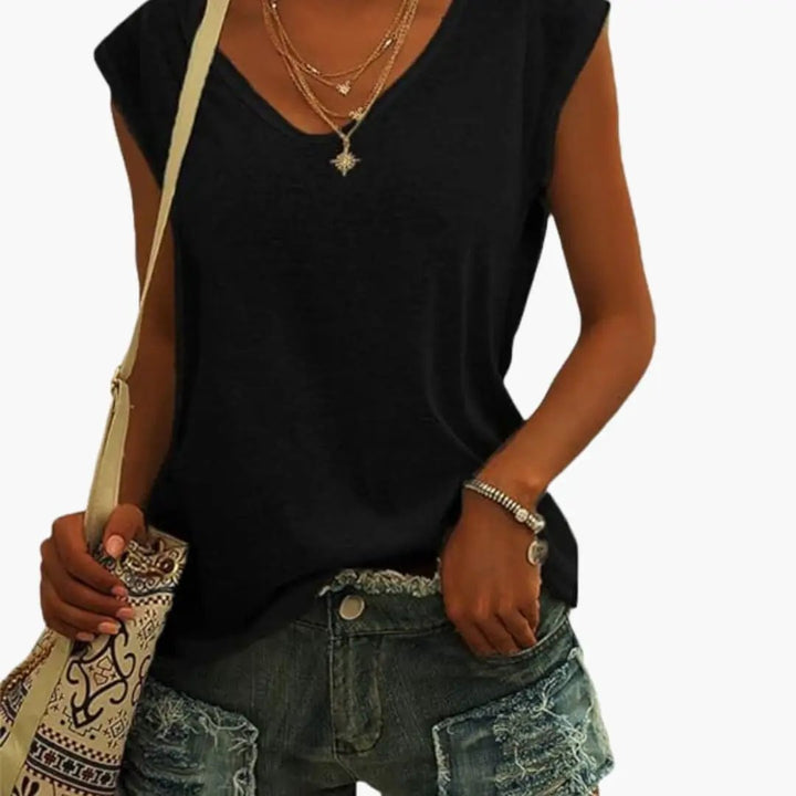Relaxed fit women's sleeveless V-neck blouse, a comfortable and stylish addition to your summer wardrobe.