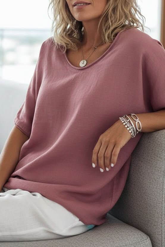 Comfortable women's relaxed fit V-neck top, ideal for summer casual, beach, or vacation outfits.