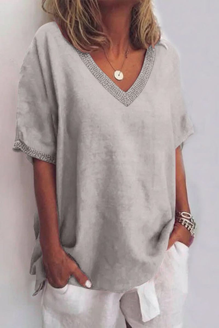 Relaxed fit V-neck women's summer top, lightweight and breathable for casual, beach, or vacation wear.