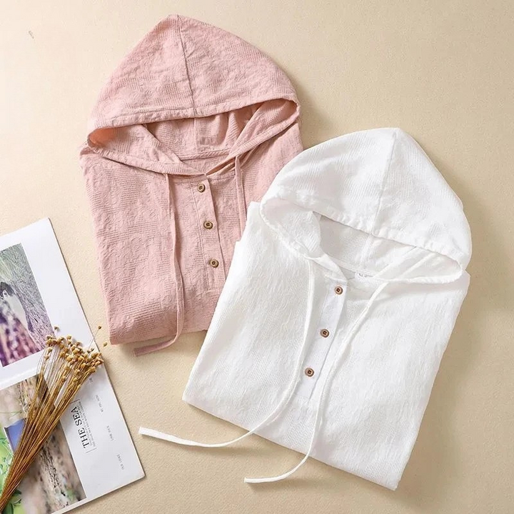 Stylish women's hooded top, a relaxed summer blouse for effortless spring fashion and comfort.