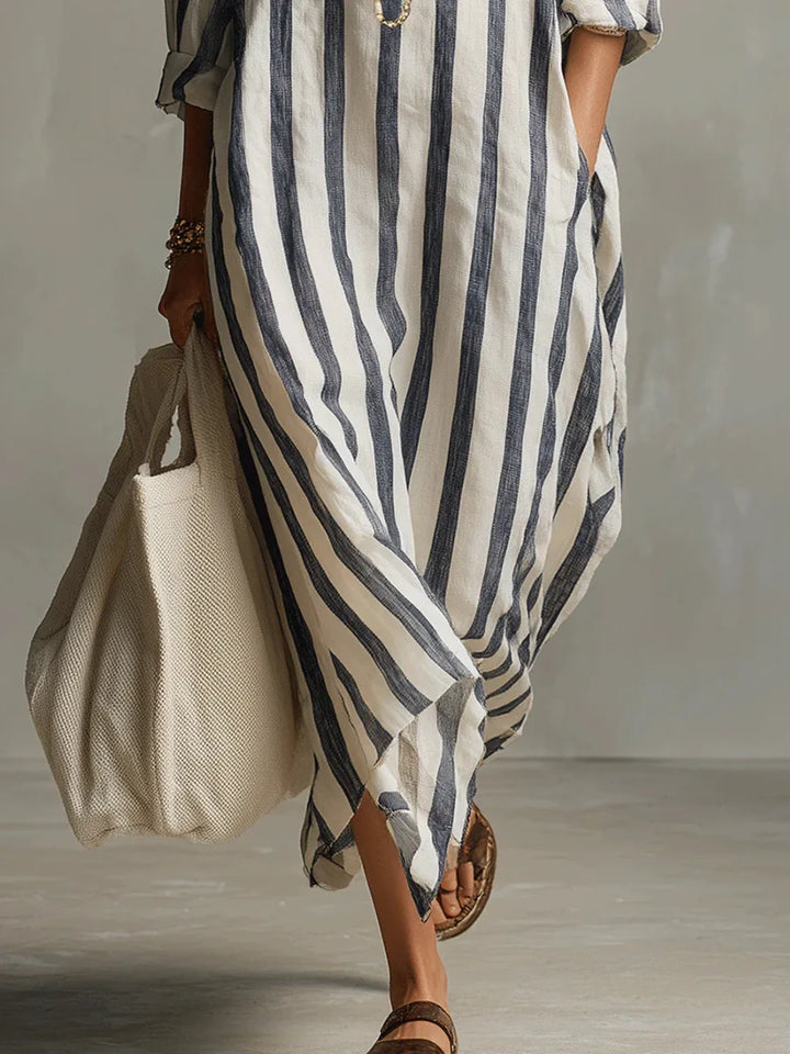 Versatile women's long striped shirt dress with V-neck, great for casual outings or beach wear.