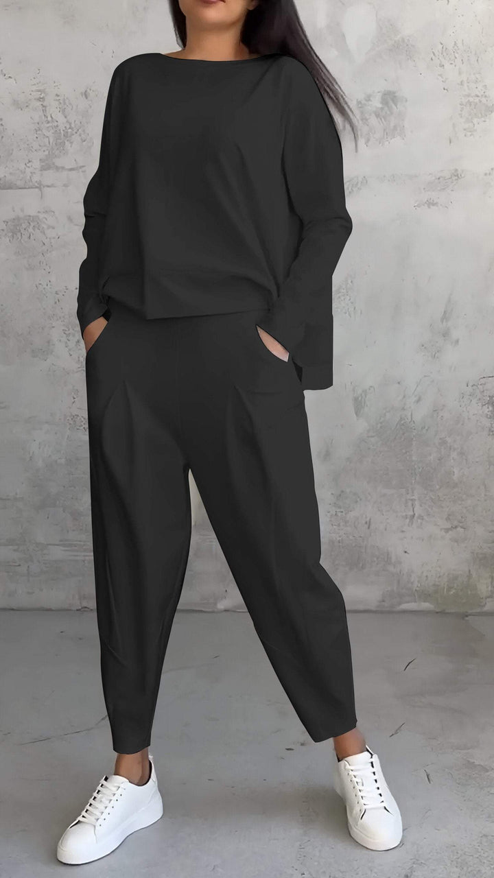 Back view of women's relaxed two-piece leisure set, showcasing its comfortable, casual fit.