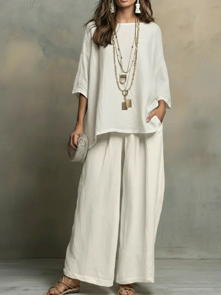 Women's relaxed two-piece outfit set with casual shirt and wide-leg pants. Perfect for summer comfort & style.