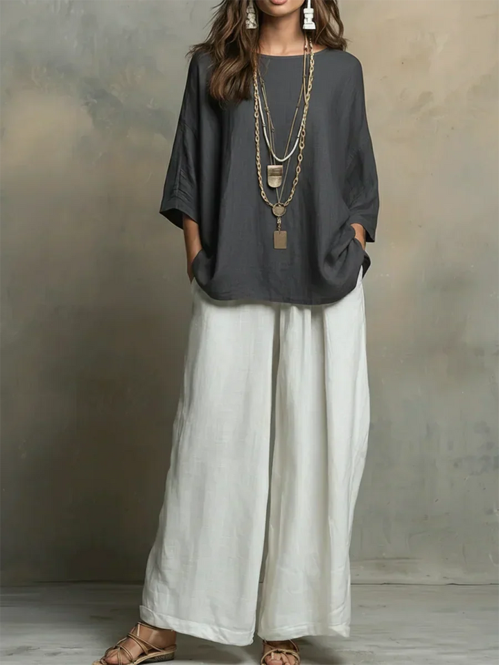 Effortless comfort in this women's relaxed two-piece outfit. Casual top & wide-leg pants for easy everyday style.
