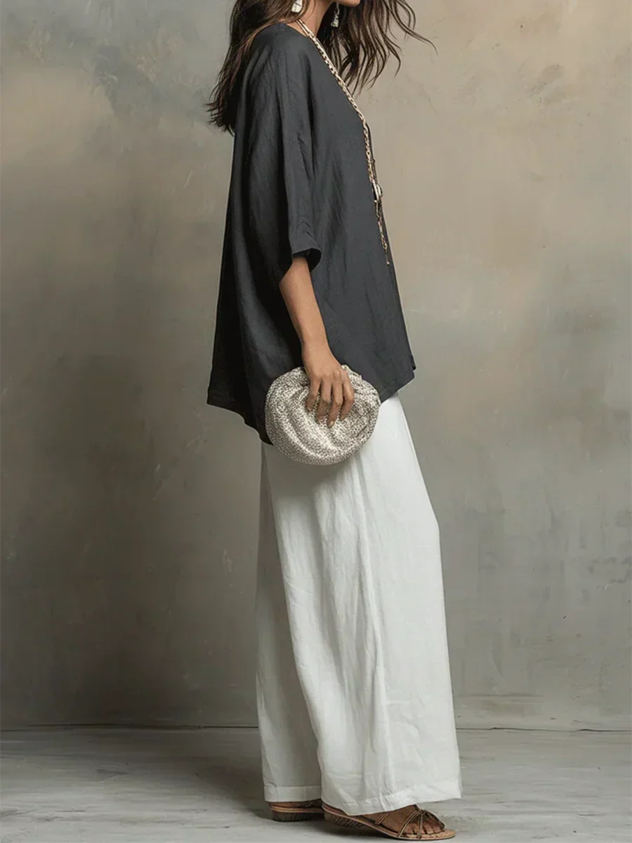 Women's relaxed fit two-piece set featuring a casual shirt and comfortable wide-leg pants. Ideal for summer.