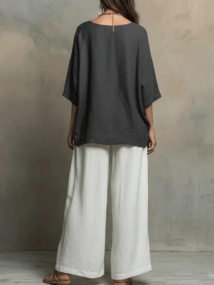 Stylish women's matching two-piece set. Relaxed shirt and wide-leg pants for comfortable loungewear or travel.