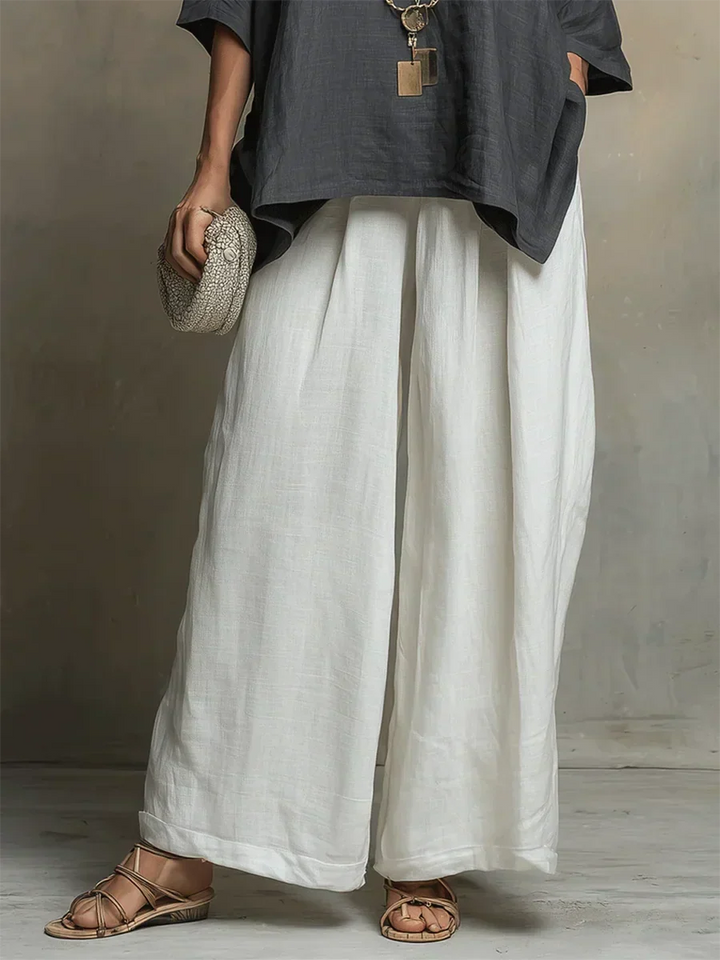 Relaxed women's two-piece outfit set for vacation or casual wear. Comfortable wide-leg pants and matching top.
