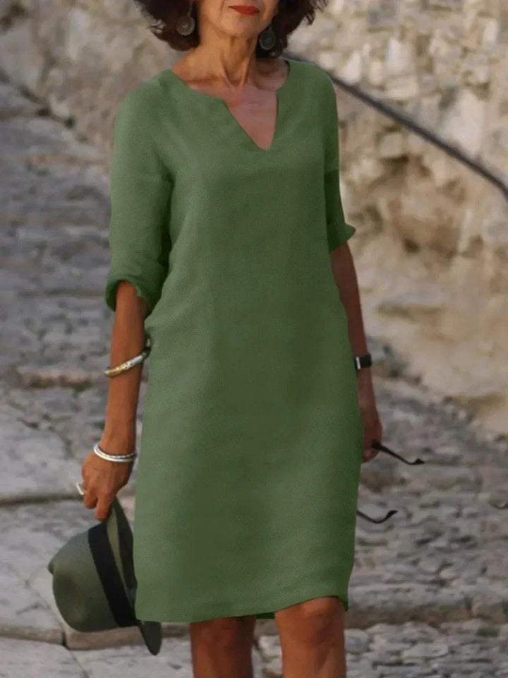 Stylish relaxed fit V-neck dress for women, ideal for versatile everyday wear.