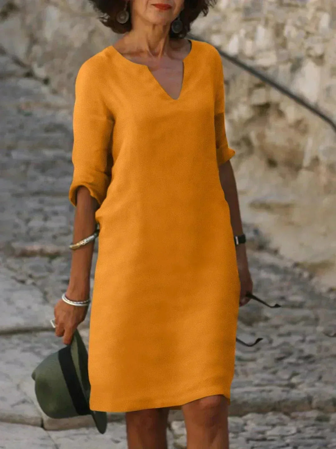 Versatile women's V-neck midi dress, relaxed fit, comfortable for any casual occasion.