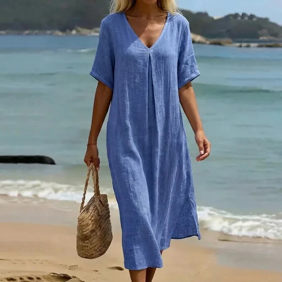 Women's relaxed V-neck midi dress, short sleeves. Perfect for casual summer days & everyday fashion.