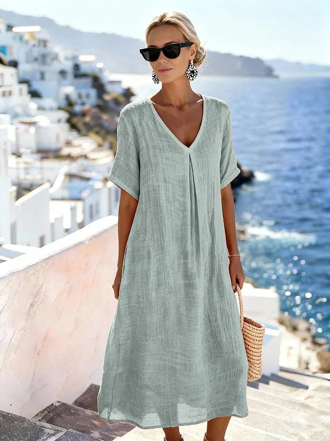 Soft-feel women's relaxed V-neck midi dress, short sleeves. Perfect for breezy summer days & comfort.