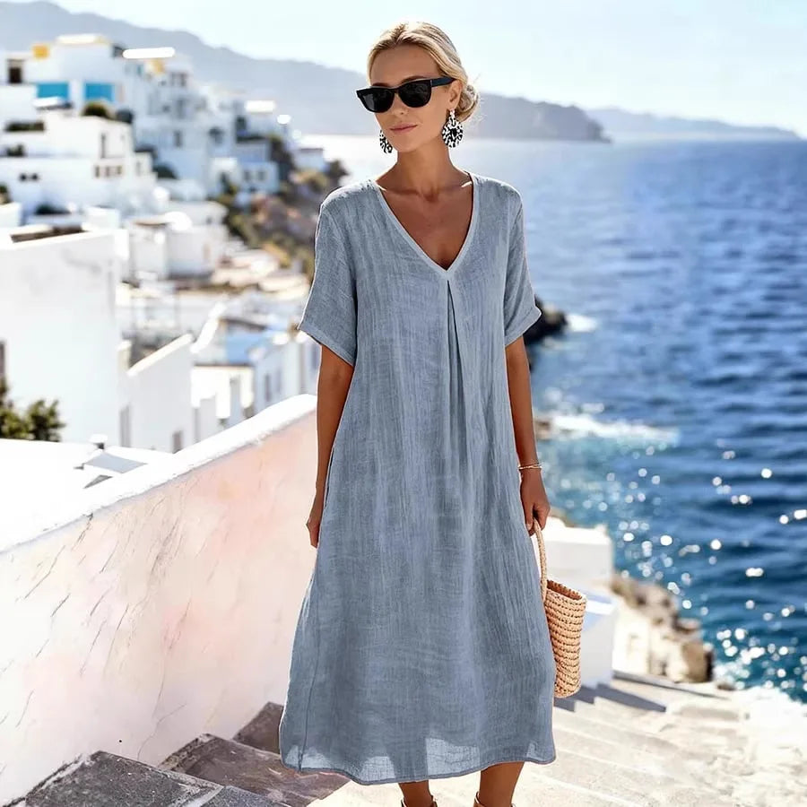 Versatile women's V-neck midi dress, short sleeve. Ideal for casual everyday fashion & beach wear.