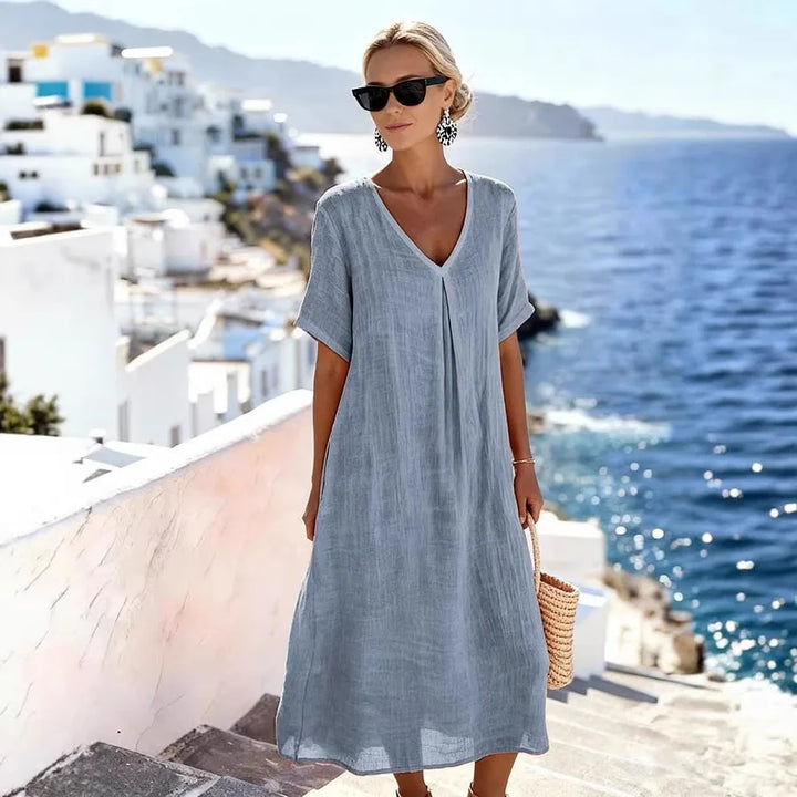 Versatile women's V-neck midi dress, short sleeve. Ideal for casual everyday fashion & beach wear.