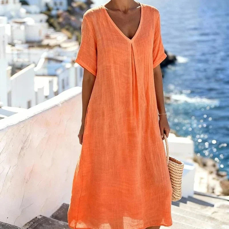 Comfortable women's short sleeve V-neck midi dress. Relaxed fit, perfect for versatile everyday wear.