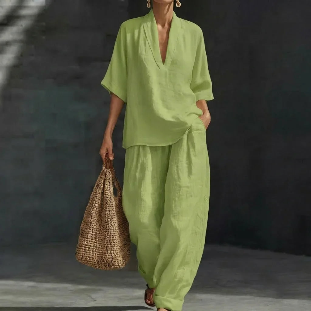 Matching women's relaxed V-neck top and wide-leg pants set. A comfortable, casual chic two-piece outfit for women.