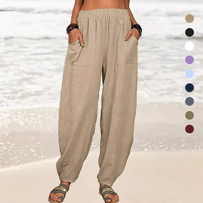 Front view of women's relaxed wide-leg beach pants, highlighting pockets & summer comfort.