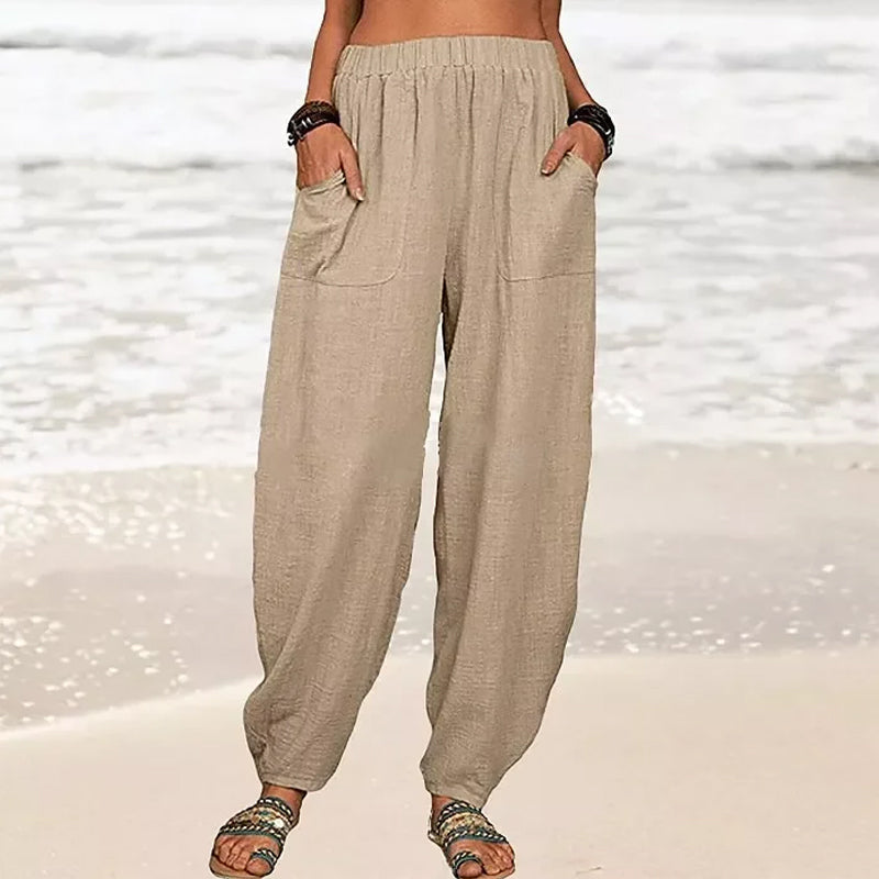 Comfortable women's wide-leg beach pants with practical pockets, ideal for summer casual wear.