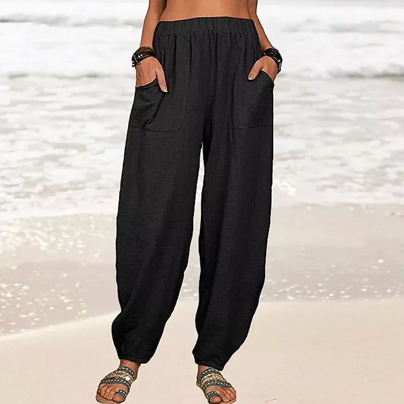 Flowy women's wide-leg beach pants in a relaxed fit, great for warm weather & vacation.