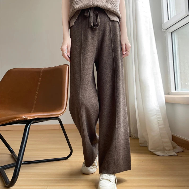 Women's relaxed wide-leg lounge pants with high waist & drawstring for comfortable casual wear.