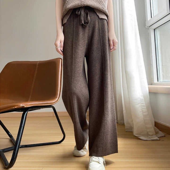 Women's relaxed wide-leg lounge pants with high waist & drawstring for comfortable casual wear.