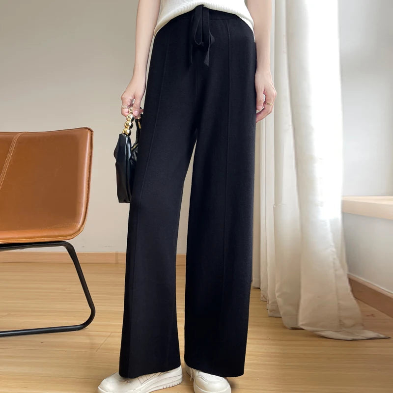 Relaxed fit women's wide-leg lounge pants. High-waisted, comfortable, perfect for casual wear with drawstring.