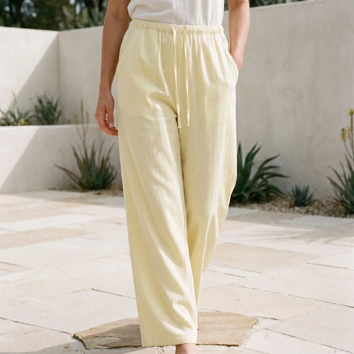 Women's relaxed wide-leg summer pants in a solid color with a comfortable drawstring waist, perfect for vacation.