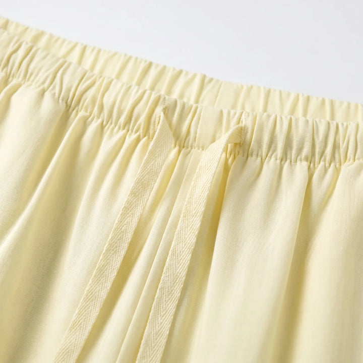 Solid color women's wide-leg summer pants. Relaxed fit, high waist, and comfortable drawstring for effortless style.