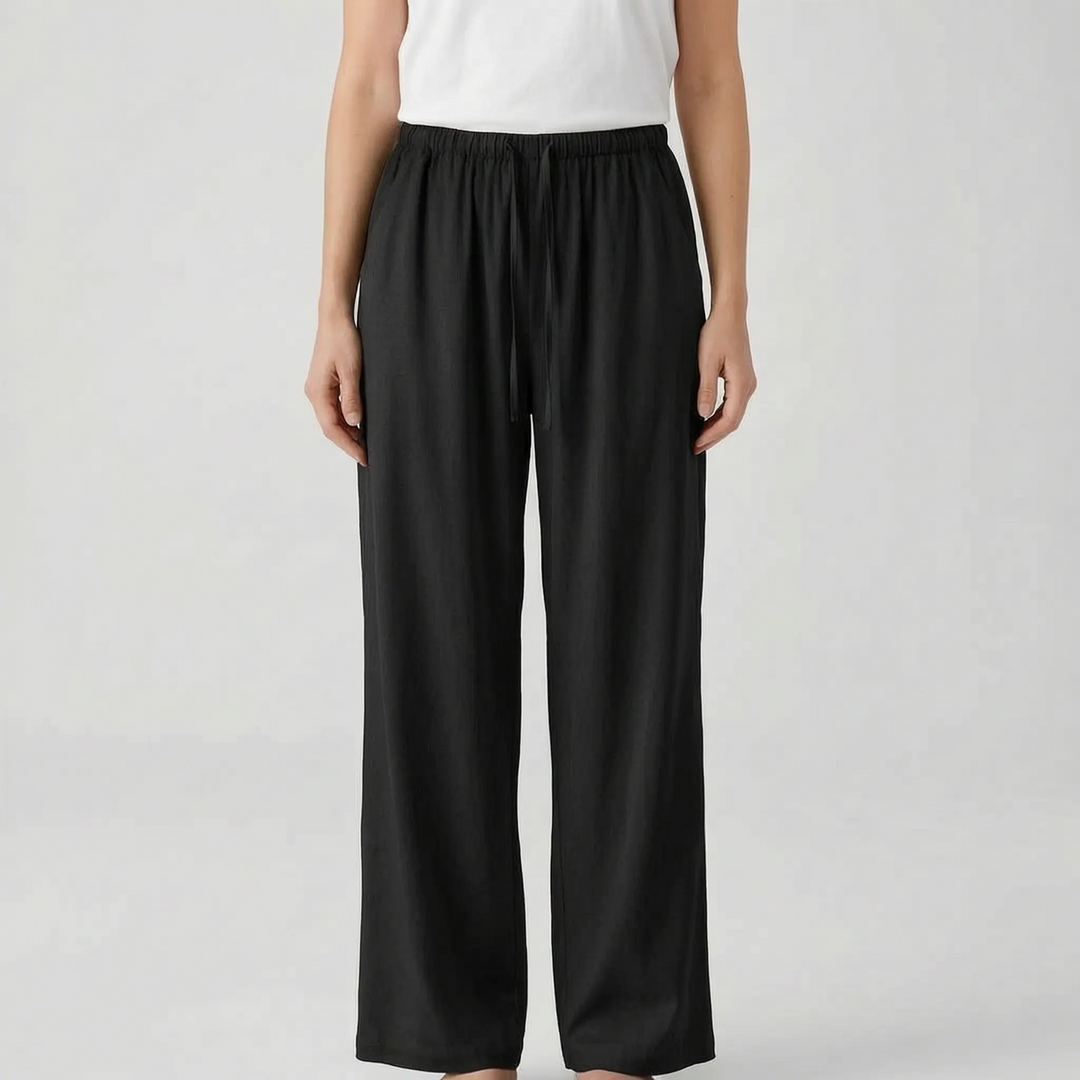 Stylish women's wide-leg summer trousers in a relaxed fit. Features a comfy drawstring waist for travel or vacation.