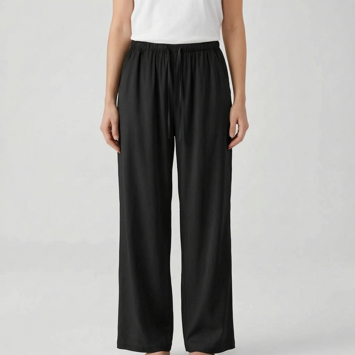 Stylish women's wide-leg summer trousers in a relaxed fit. Features a comfy drawstring waist for travel or vacation.