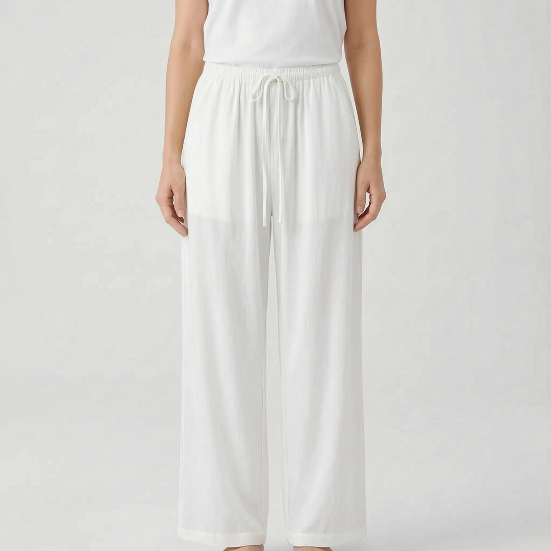 Relaxed fit women's wide-leg pants. Breezy summer trousers with a drawstring waist, perfect for casual wear or travel.