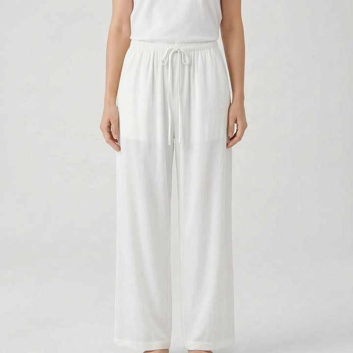 Relaxed fit women's wide-leg pants. Breezy summer trousers with a drawstring waist, perfect for casual wear or travel.